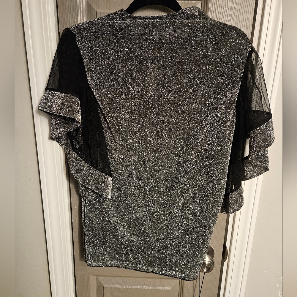 SALE ** BRAND NEW ** Sparkling Silver Top with Sheer Black Sleeves